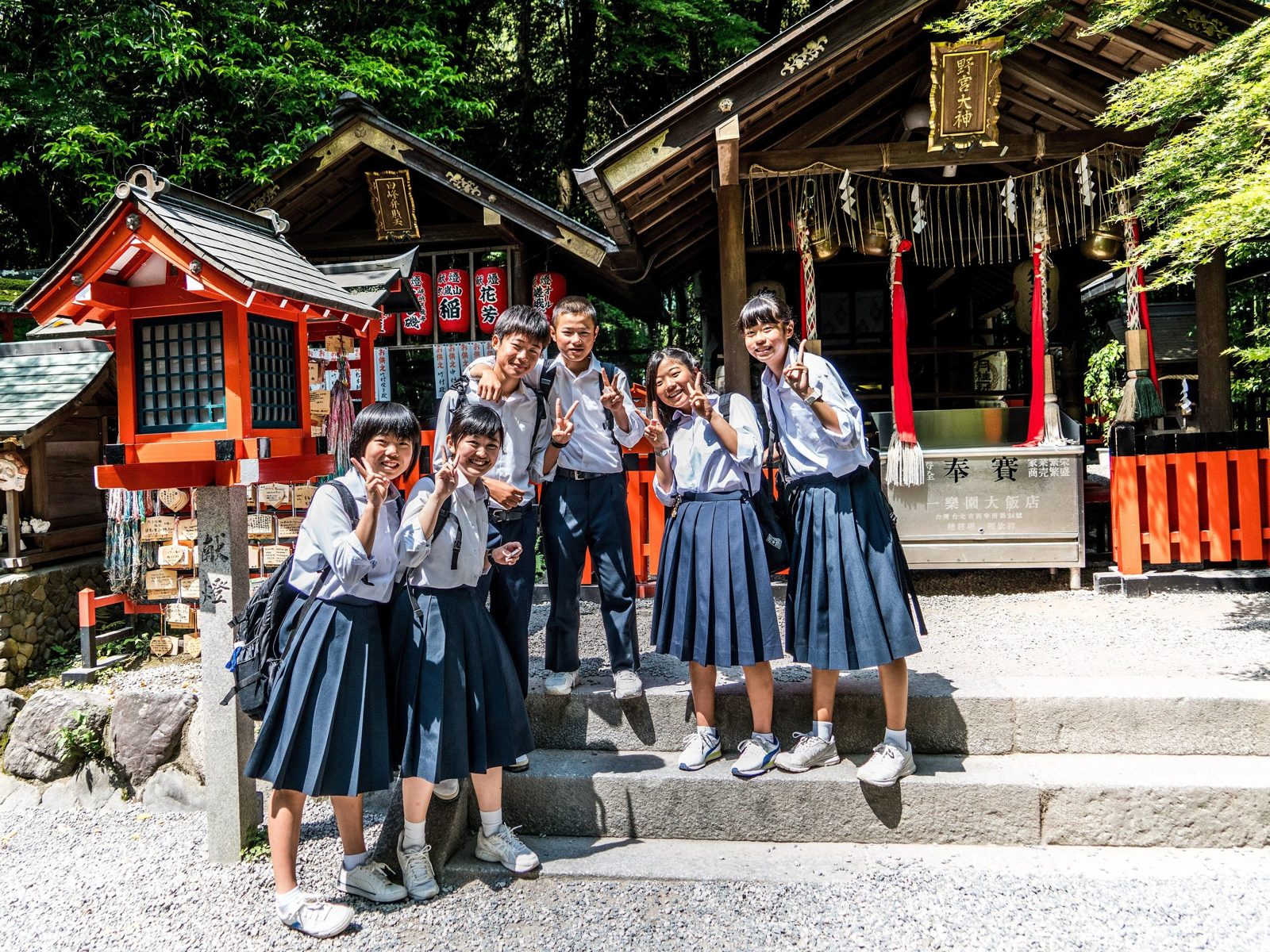 School students visiting a shrine in Kyoto, Japan.