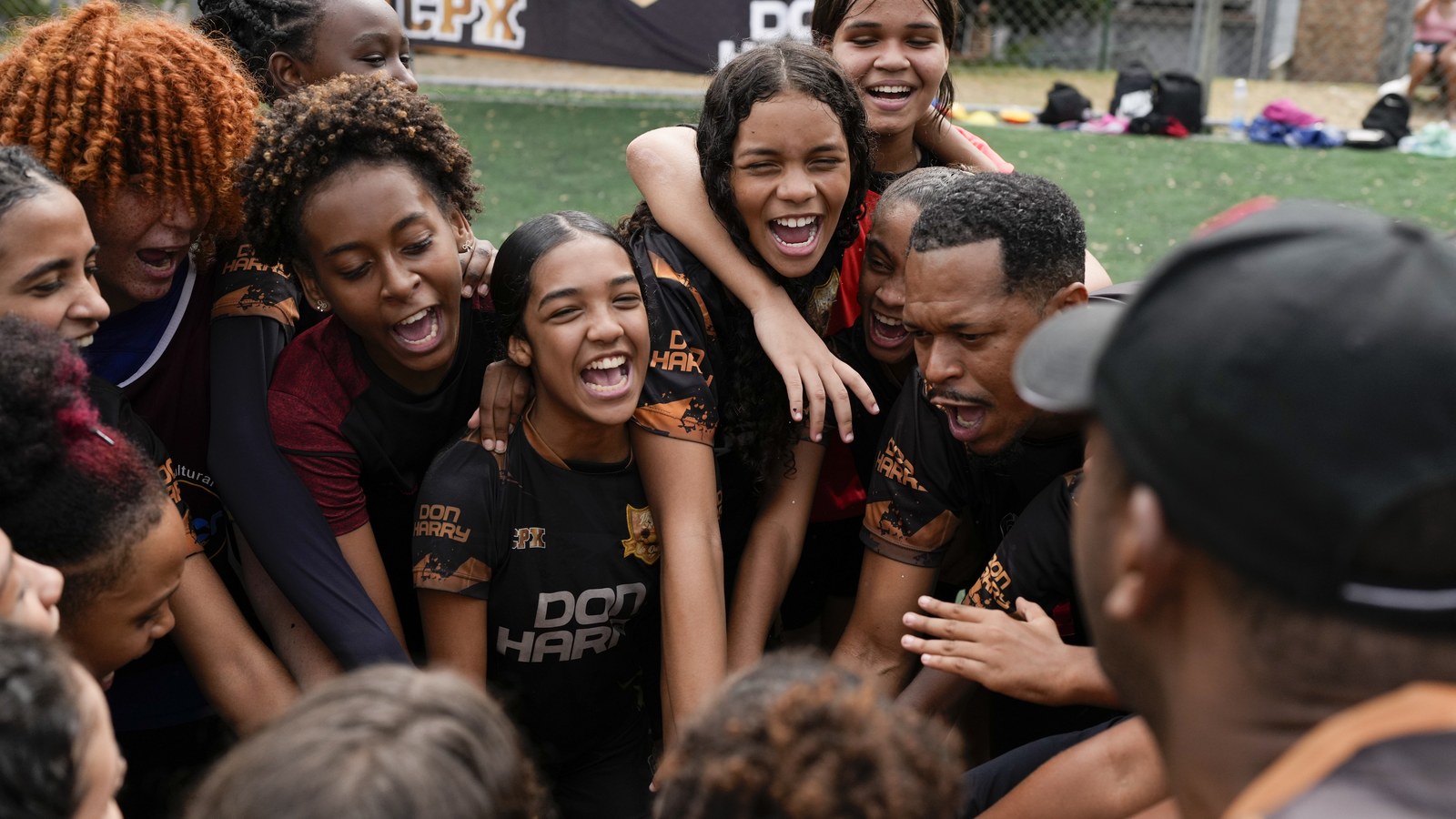 Young football team celebrating together in Brazil — the spirit of the Brazilian game