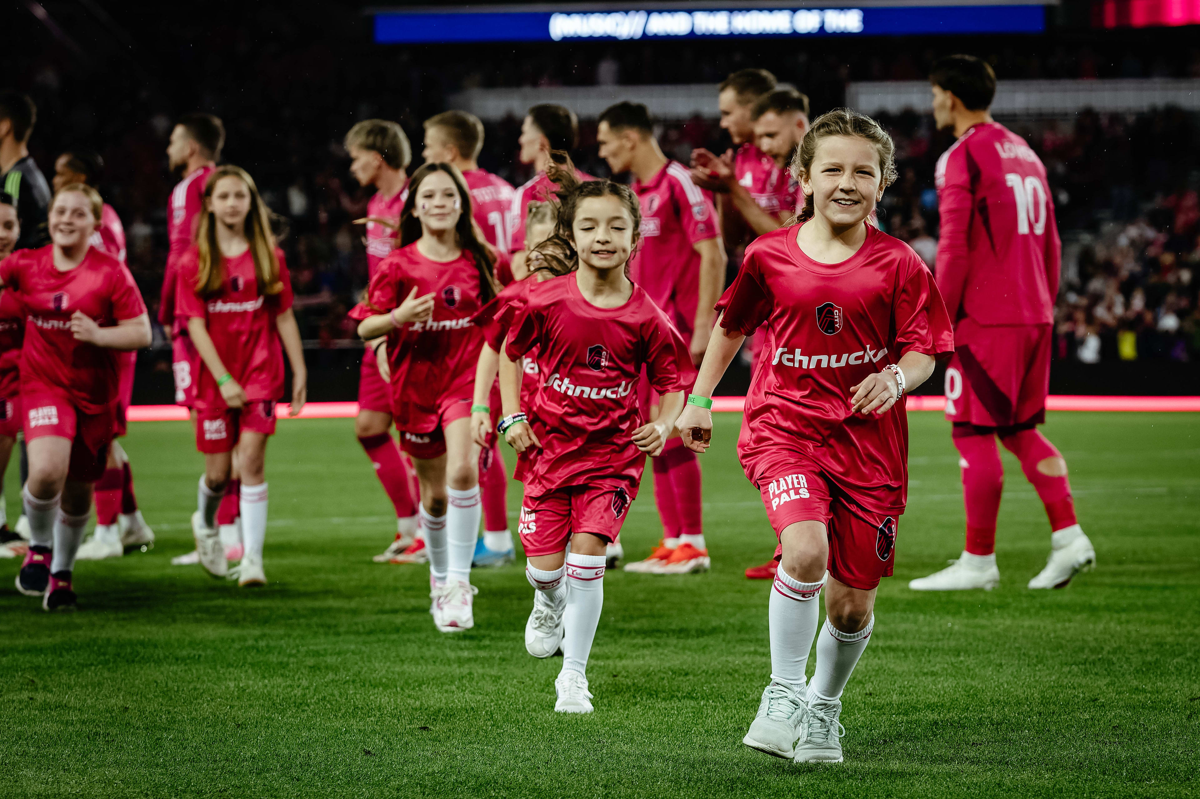 Youth soccer players competing on a pitch in the USA