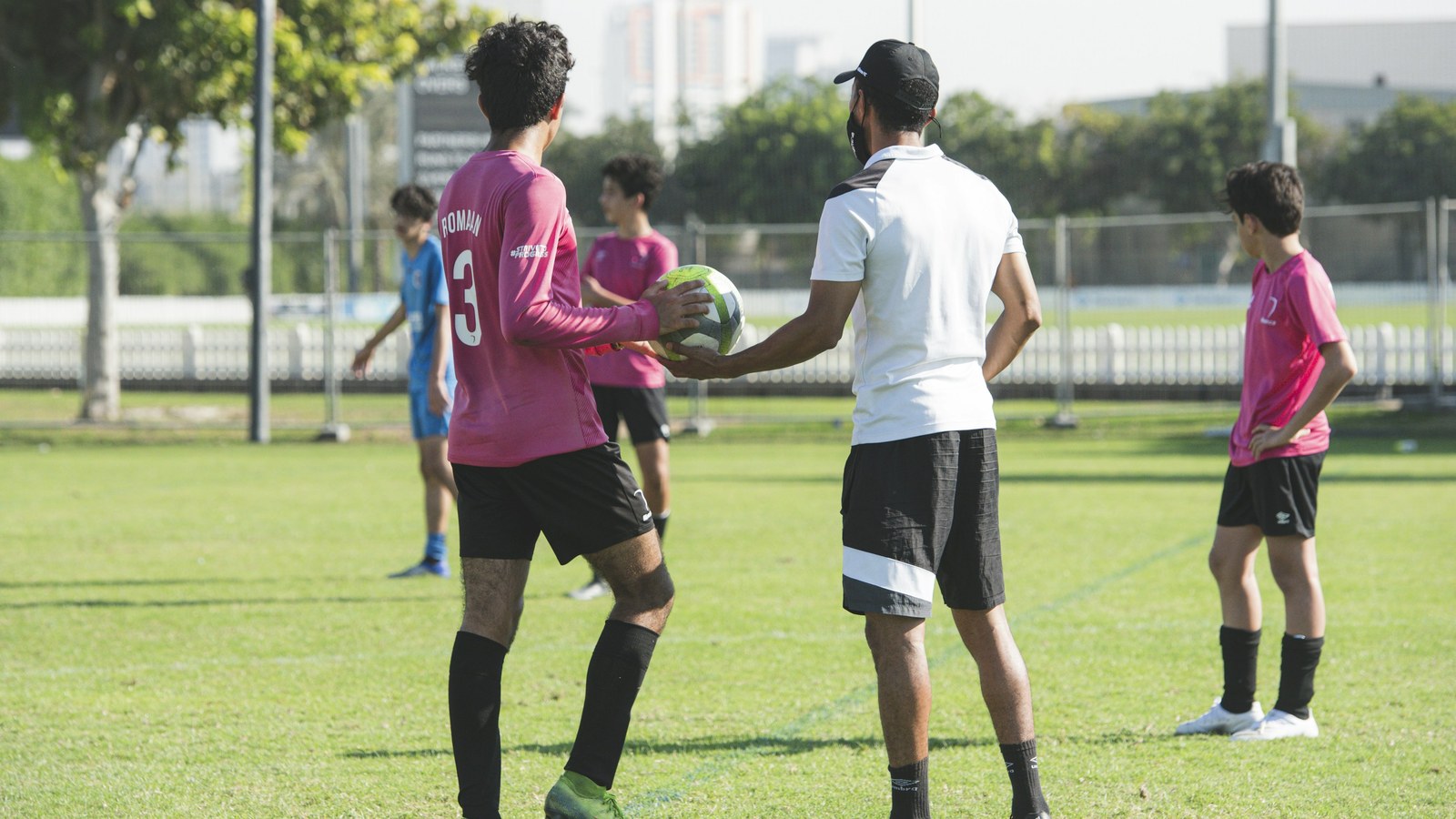 Young footballers training on a grass pitch in Dubai ahead of the Mina Cup 2027 tournament