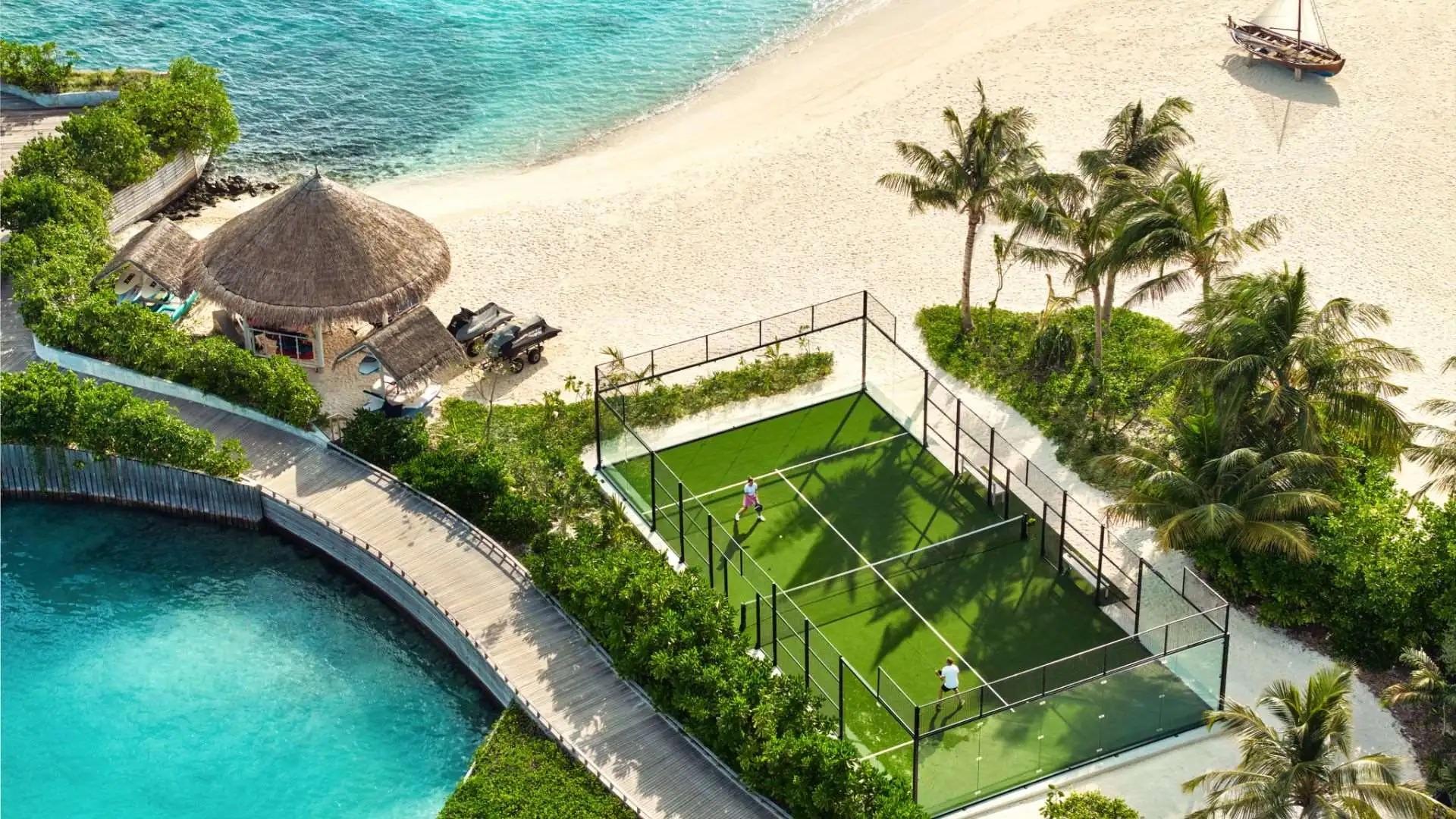 Luxury beachfront padel courts at tropical resort with ocean views