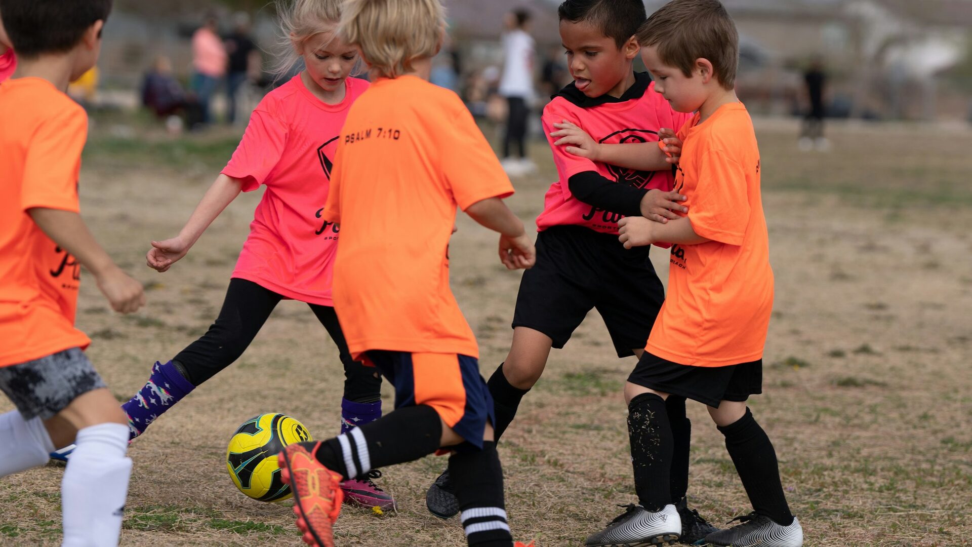 Youth football team training safely in Brazil.