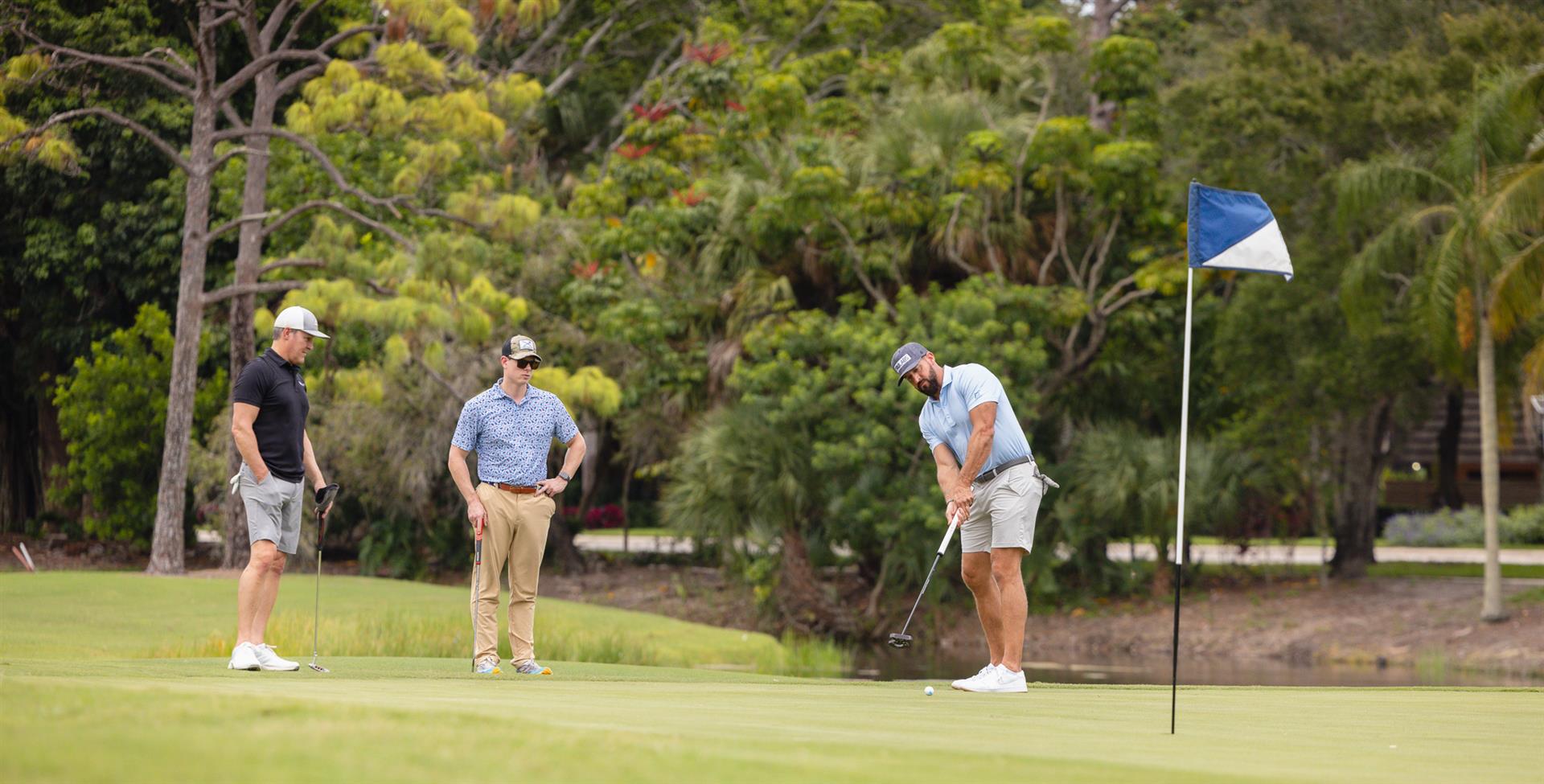 Golfers competing in a group golf tournament on a championship course