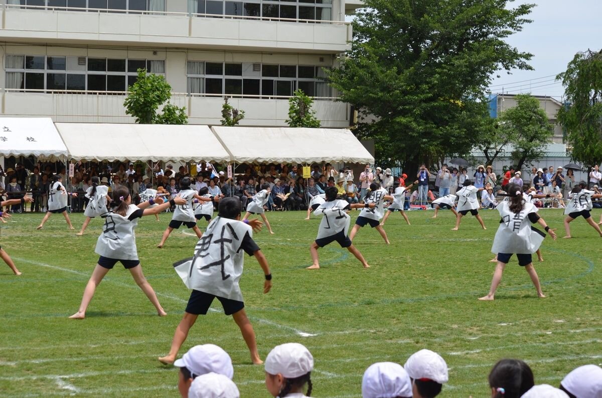 Japanese students taking part in a school sports day event