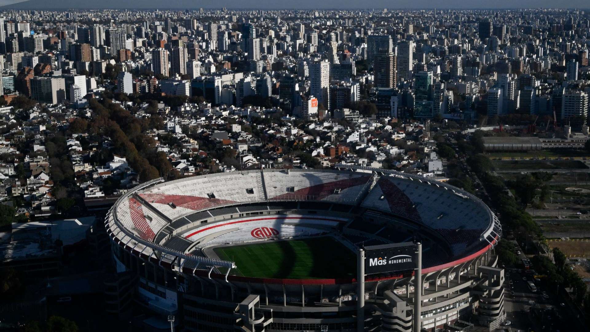 Panoramic view of Buenos Aires skyline and sports venues at golden hour